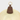 Brown leather magnetic hat clip with 'Layover' text attached to a straw hat on a light gray background