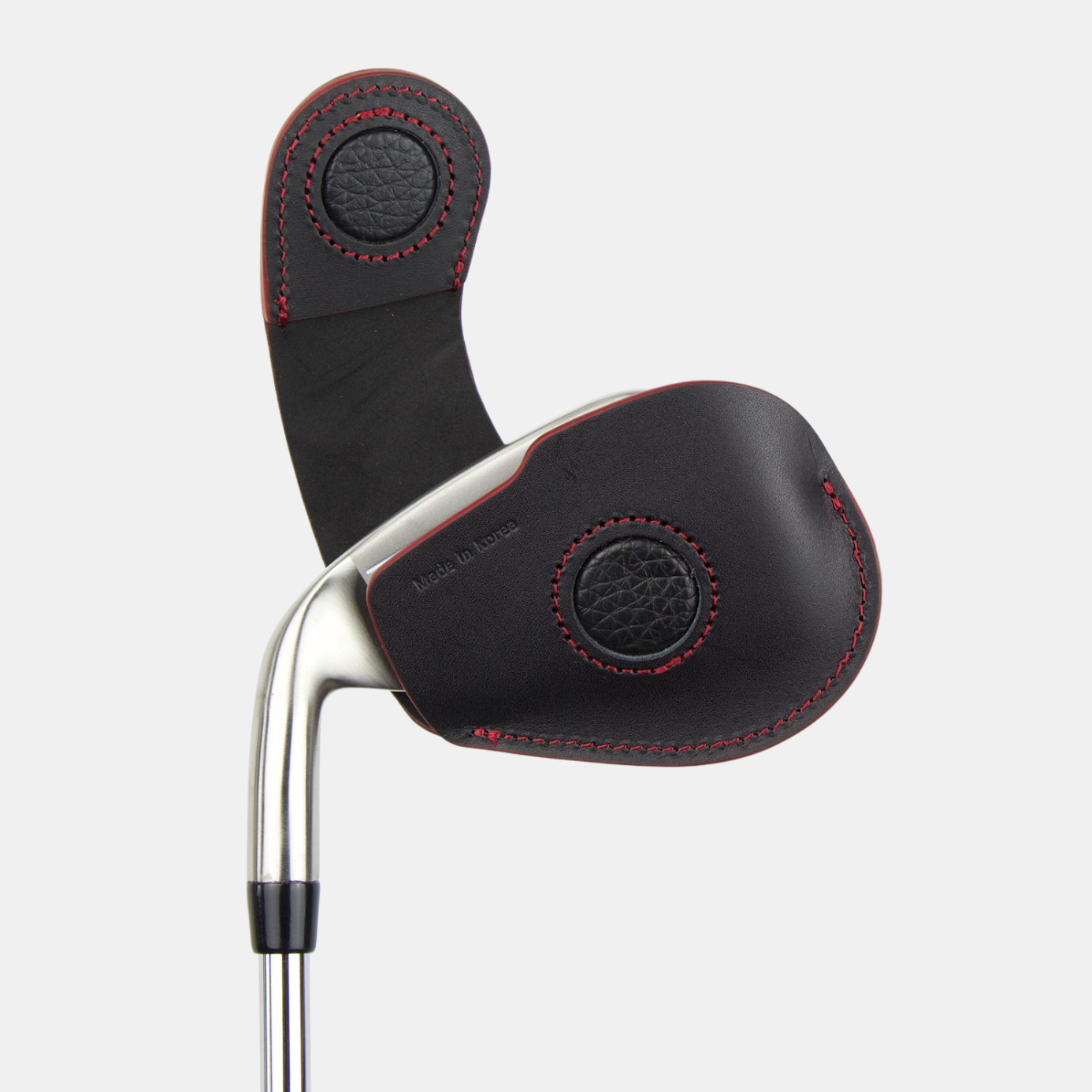 Leather magnetic golf club iron head cover with 'Layover and Co.' branding on a white background 