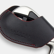 Close up leather magnetic golf club iron head cover with 'Layover and Co.' branding on a white background
