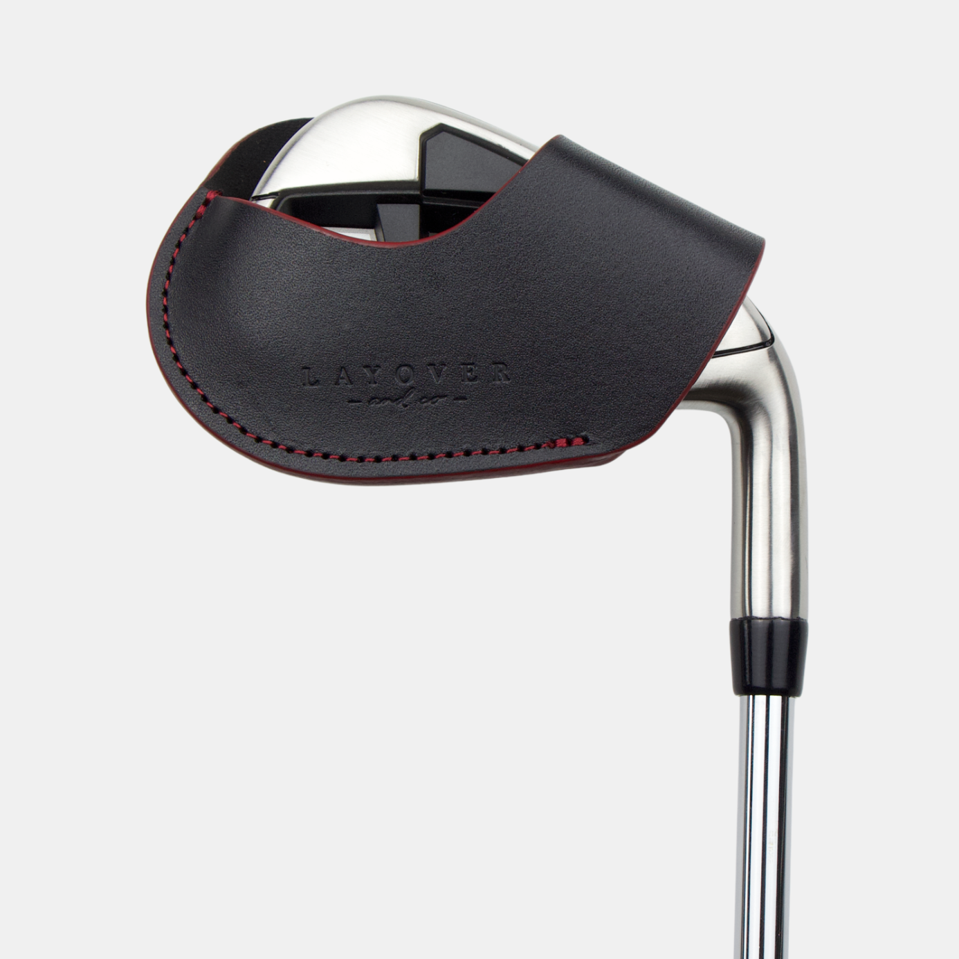 Leather magnetic golf club iron head cover with 'Layover and Co.' branding on a white background