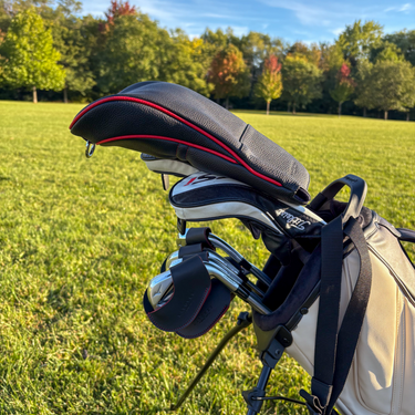 A set of golf clubs with leather magnetic iron covers and a pebble leather driver head cover 