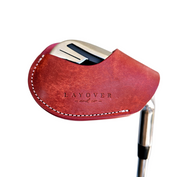 Studio shot of leather magnetic golf iron covers in red neatly arranged to showcase their smooth texture, precise stitching, and minimalist design under soft lighting.