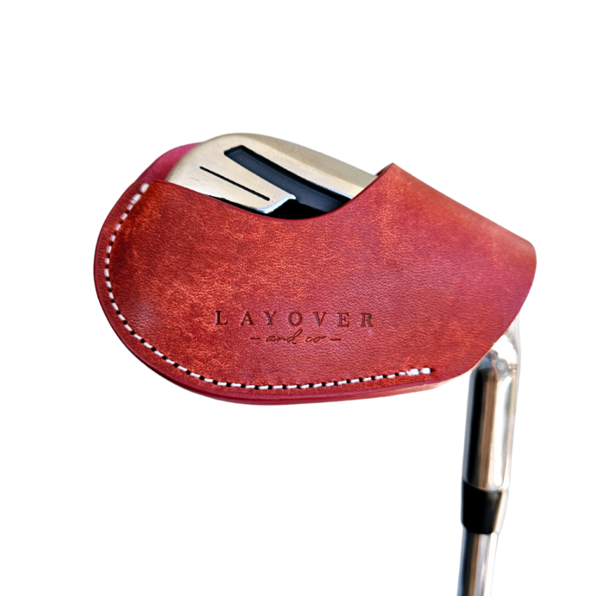 Studio shot of leather magnetic golf iron covers in red neatly arranged to showcase their smooth texture, precise stitching, and minimalist design under soft lighting.